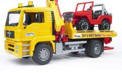 Image of Bruder Man Replica Tow Truck With Country Vehicle